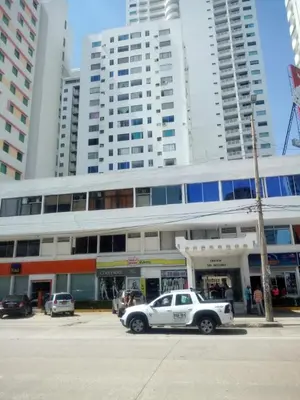 a police car parked in front of a building with tall buildings at Comodo Apartamento en Bocagrande Cartagena 801B in Cartagena de Indias
