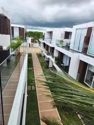 an aerial view of a building with palm trees at Costa Serena Casa 3 in Coveñas
