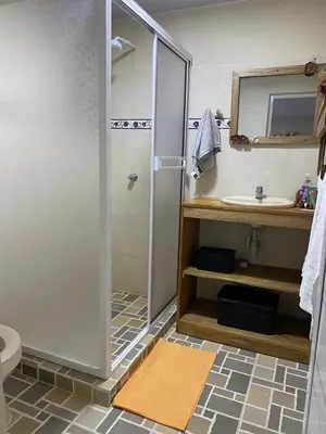 a bathroom with a shower and a sink at Zéfiro Hostal in San Bernardo del Viento