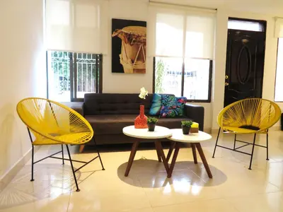 a living room with two chairs and a couch at SAN JACINTO HOSTEL in Cartagena de Indias