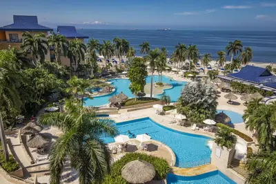 an aerial view of a resort with two pools at Zuana Beach Resort in Santa Marta