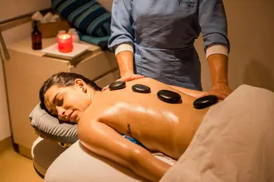 a man getting a back massage in a salon at Zuana Beach Resort in Santa Marta