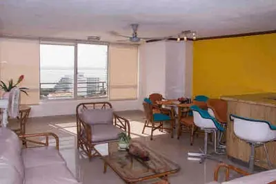 a living room with a table and chairs at IV 2 bedroom apartment in Cartagena de Indias