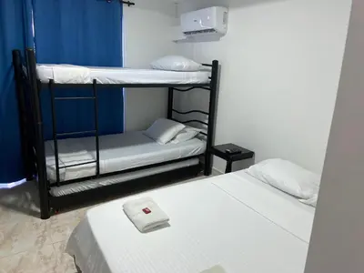 two bunk beds in a small room withthritisthritisthritisthritisthritisthritisthritisthritis at Hotel Blue Diamond House in Cartagena de Indias