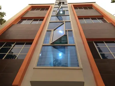 a tall building with a lot of windows at Hotel Torres del Parque No1 in Soledad