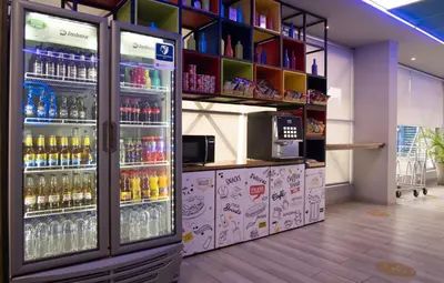 a refrigerator filled with lots of drinks in a store at ibis budget Barranquilla in Barranquilla