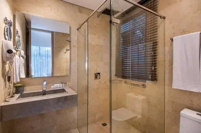 a bathroom with a glass shower and a sink at Oz Hotel Luxury in Cartagena de Indias