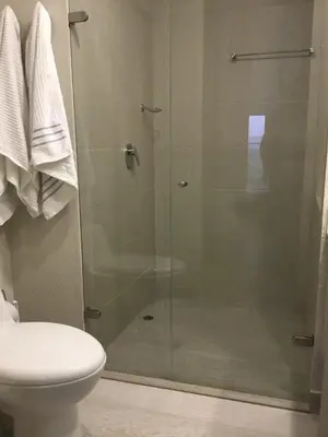 a bathroom with a glass shower with a toilet at Martinique1621 in Cartagena de Indias