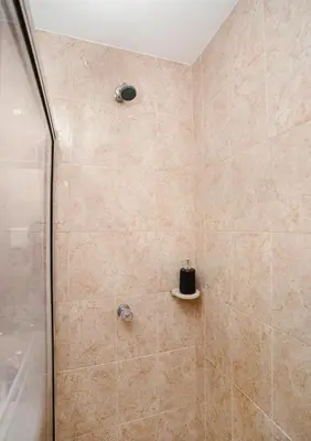 a bathroom with a shower with a glass door at Casa Franco Hotel in Cartagena de Indias