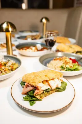 a table full of plates of food on a table at Casa Franco Hotel in Cartagena de Indias