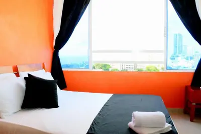 a bed in a room with a large window at Loft sea view 11C air and wifi in Cartagena de Indias