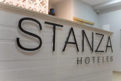 a sign for a hotel in a building at Stanza Hotel Sincelejo in Sincelejo
