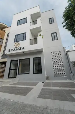 a white building with the name stanza on it at Stanza Hotel Sincelejo in Sincelejo