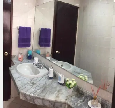 a bathroom with a sink and a mirror at Cartagena Escape Plaza in Cartagena de Indias