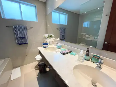 a bathroom with two sinks and a large mirror at Casa de Playa in Cartagena de Indias
