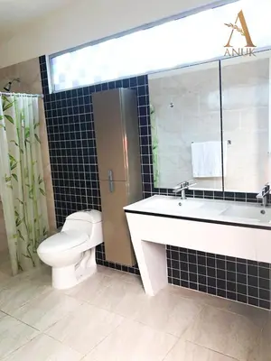 a bathroom with a toilet and a sink and a mirror at Anuk Glamping in San Bernardo del Viento