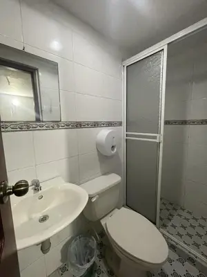 a bathroom with a toilet and a sink at Hotel Mangata in Cartagena de Indias