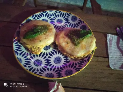 two donuts on a blue and white plate on a table at Los Versos de Zaira in San Onofre