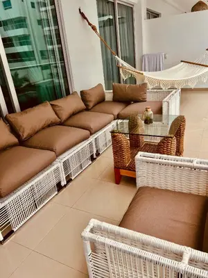 a living room with a couch and a hammock at MORROS EPIC luxury beach in Cartagena de Indias