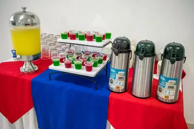 a table with some drinks and a pitcher of juice at Hotel ITACO in Cartagena de Indias