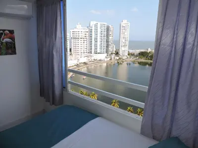 a room with a window with a view of a body of water at Estudio Loft Cartagena in Cartagena de Indias