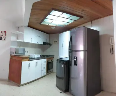 a kitchen with a stainless steel refrigerator and a skylight at Oferta frente a la playa Cartagena . En, Sp, It. in Cartagena de Indias
