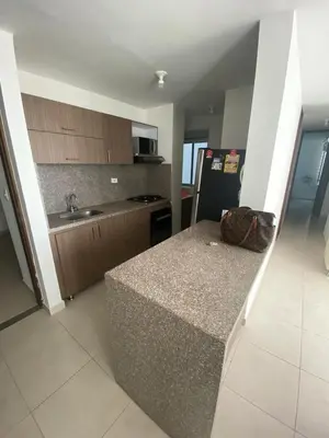 a kitchen with a counter in the middle of it at Torino Barranquilla- Miramar in Barranquilla