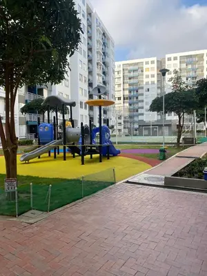 a park with a playground with a slide and swings at Torino Barranquilla- Miramar in Barranquilla