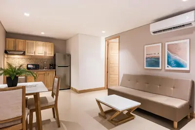 a living room with a couch and a table at Apartamentos casa Gimani in Cartagena de Indias