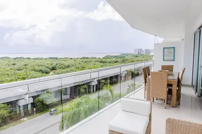 a room with a balcony with a table and chairs at MORROS EPIC 1 ALCOBA VISTA CIENAGA in Cartagena de Indias