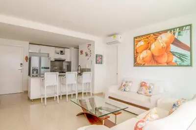 a living room with a couch and a table at Morros Epic 2 Bedrooms Beachfront by Inmobiliaria MFR in Cartagena de Indias