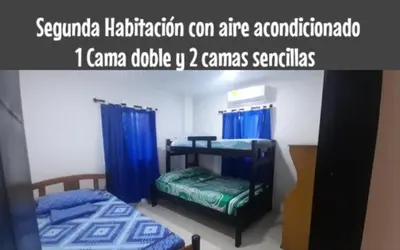 a picture of a bedroom with two bunk beds at Apartamento JHON in Coveñas