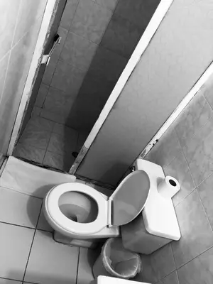 a bathroom with a toilet in a stall at Tita’s Airport Hotel in Cartagena de Indias