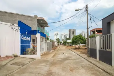an empty street in a city with buildings at Cabana Costa Azul in Coveñas