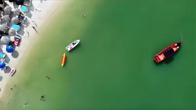 an overhead view of boats in the water at a beach at AMALIFE Beach Club & Hotel in Tierra Bomba