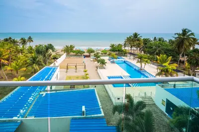 an aerial view of the pool at the beachfront resort at Magico Apartamento Frente al Mar 3 Habitaciones AR44 in Coveñas