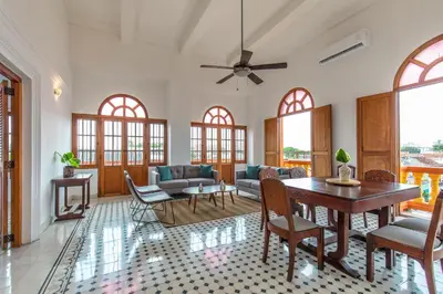 a living room with a table and chairs at Casa Morales Getsemaní in Cartagena de Indias