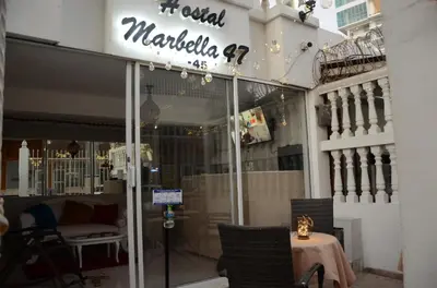 a store front of a mall with a table and chairs at Hostal Marbella 47 in Cartagena de Indias