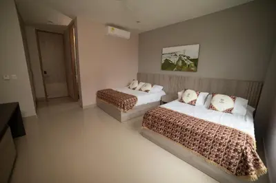 a hotel room with two beds in a bedroom at La Bonita Luxury Ecohotel in Sahagún