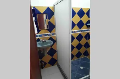 a bathroom with a mirror and a sink at PLAYA BLANCA SANANTERO CORDOBA las palmeras D’JC in San Antero