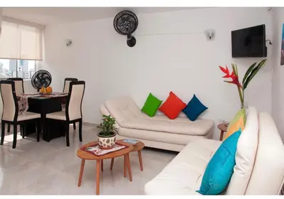 a living room with a couch and a table at III NICE 2 BEDROOM APARTMENT Bocagrande in Cartagena de Indias