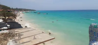 a group of people in the water at a beach at Apto Nacaela-Bocagrande cerca a la playa in Cartagena de Indias