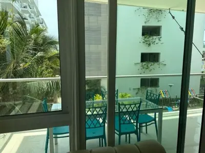 a room with a table and chairs and a window at Morros Vitri memorable in Cartagena de Indias
