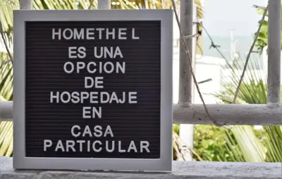 a sign on a window in front of a building at HOMEthel in Cartagena de Indias