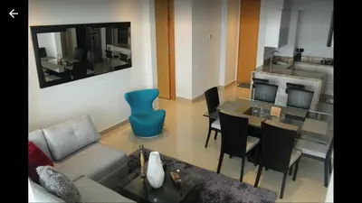a living room with a couch and a table at H2 Hyatt Vista Mar!! in Cartagena de Indias