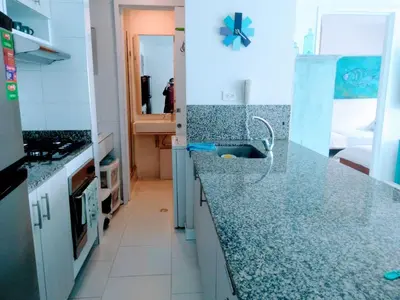 a kitchen with granite counter tops and a sink at Apartamento con excelente vista al mar Dos alcobas los Morros in Cartagena de Indias