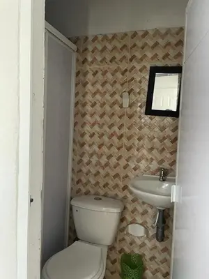 a small bathroom with a toilet and a sink at sophia house in Cartagena de Indias