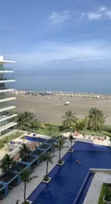 a view of a resort with a swimming pool and a beach at MORROS ULTRA APTO 706 in Cartagena de Indias