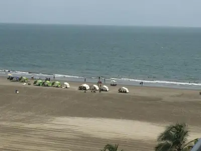 a group of tents on a beach near the ocean at MORROS ULTRA APTO 706 in Cartagena de Indias