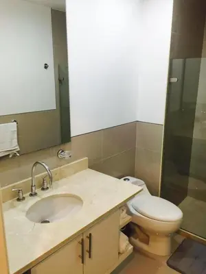 a bathroom with a sink and a toilet and a mirror at MORROS ULTRA APTO 706 in Cartagena de Indias